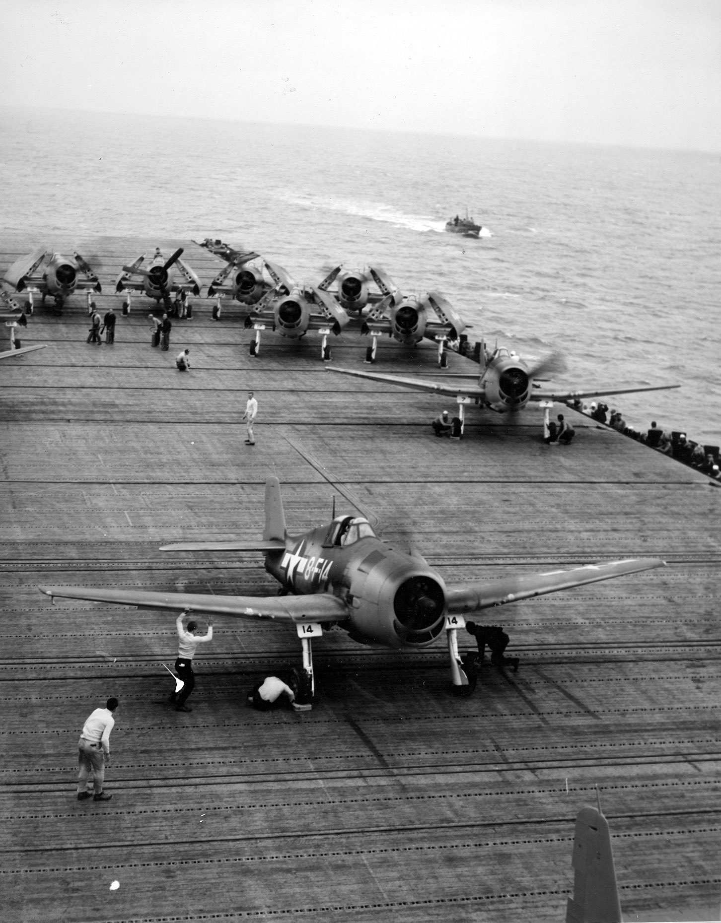 F6F Hellcat aircraft of Fighting Squadron 8 warm up on USS Intrepid's flight deck, 1943, photo 1 of 2; probably during stateside shakedown training