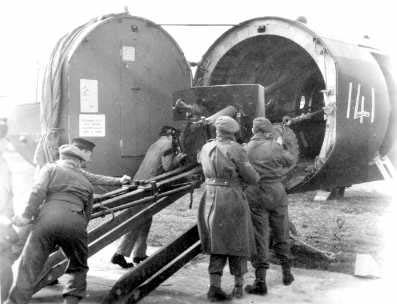 British troops loading field gun aboard Horsa Mk II glider with glider nose section swung away, date unknown