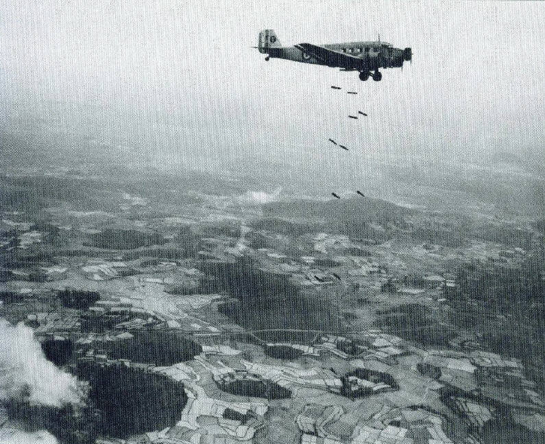 Ju 52/3m aircraft dropping bombs, date unknown