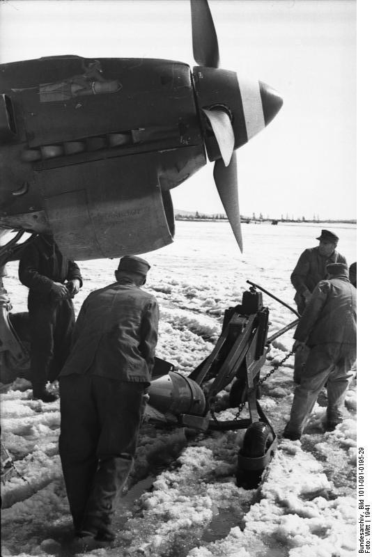 German armorers loading a bomb onto a Ju 87 Stuka dive bomber, Norway, 1941