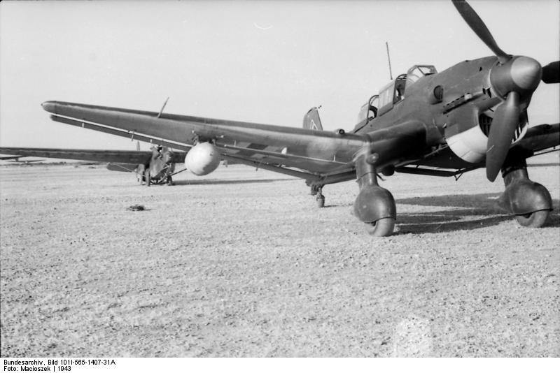 German Ju 87 Stuka dive bomber being prepared to tow a DFS 230 glider, Sicily, Italy, 1943, photo 1 of 2