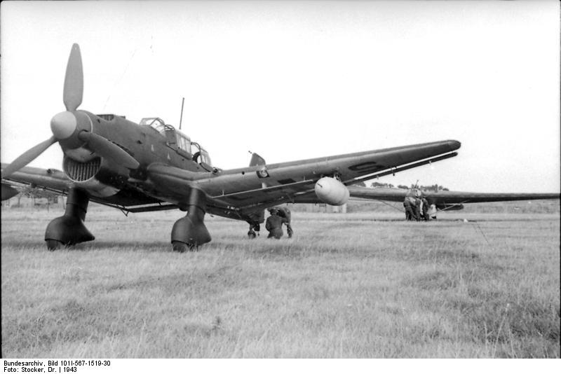 German Ju 87 Stuka dive bomber being prepared to tow a DFS 230 glider, Sicily, Italy, 1943, photo 2 of 2