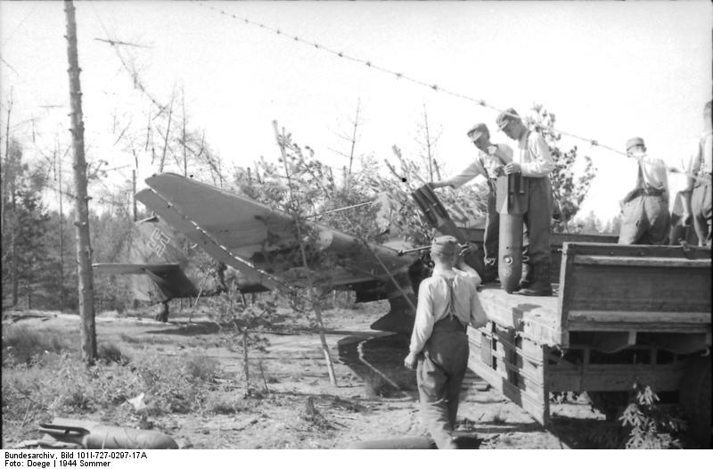 German crew unloading bombs for Ju 87 Stuka dive bombers from a truck, Russia, summer 1944
