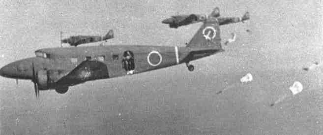 Paratroopers jumping out of a Ki-34 aircraft during an exercise, circa 1940s