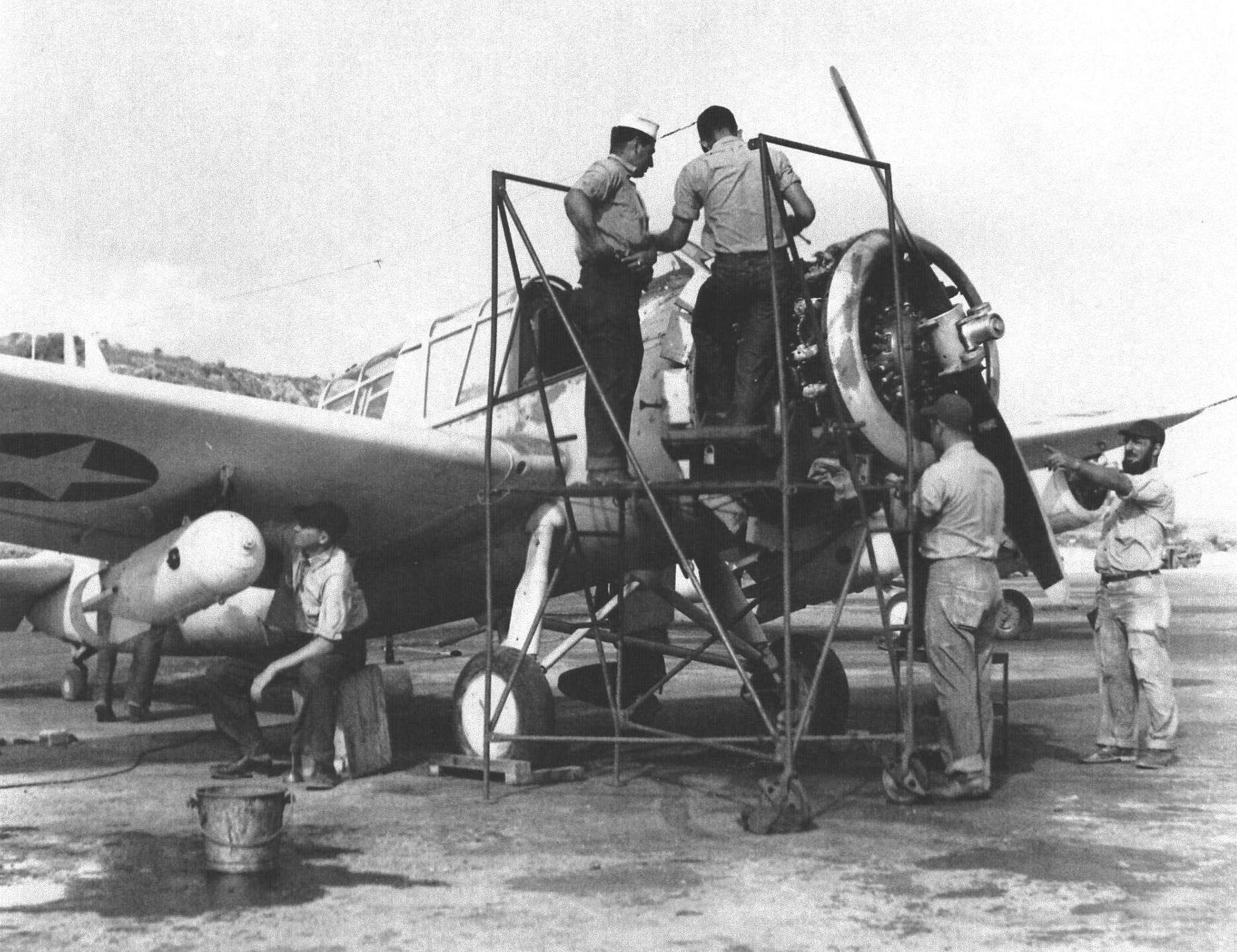 US Navy Scouting Squadron 44 (VS-44) maintenance crew working on a land-variant OS2U Kingfisher aircraft, Hato Field, Curaçao, Dutch West Indies, circa early to mid 1943