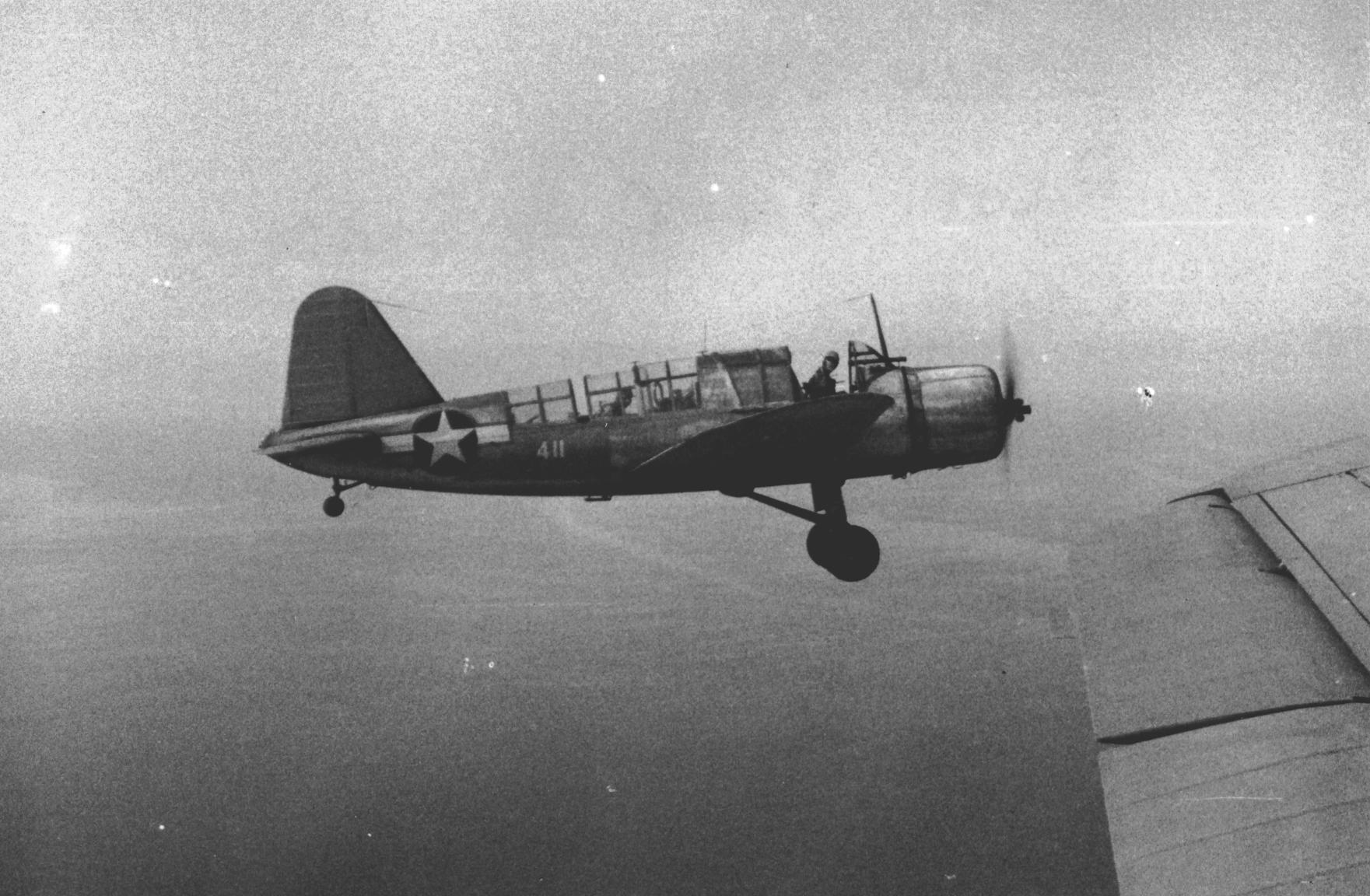 US Navy Scouting Squadron 44 (VS-44) OS2U Kingfisher aircraft, piloted by Ens. J. Clay Staples, in flight over southern Caribbean Sea, circa Jul 1943