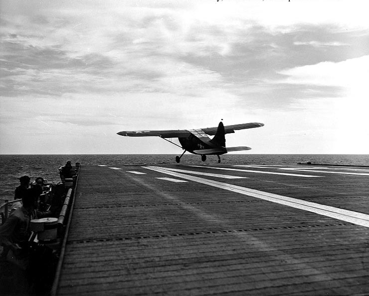 US Navy OY-2 Sentinel aircraft taking off from escort carrier Sicily, Yellow Sea, 22 Sep 1950