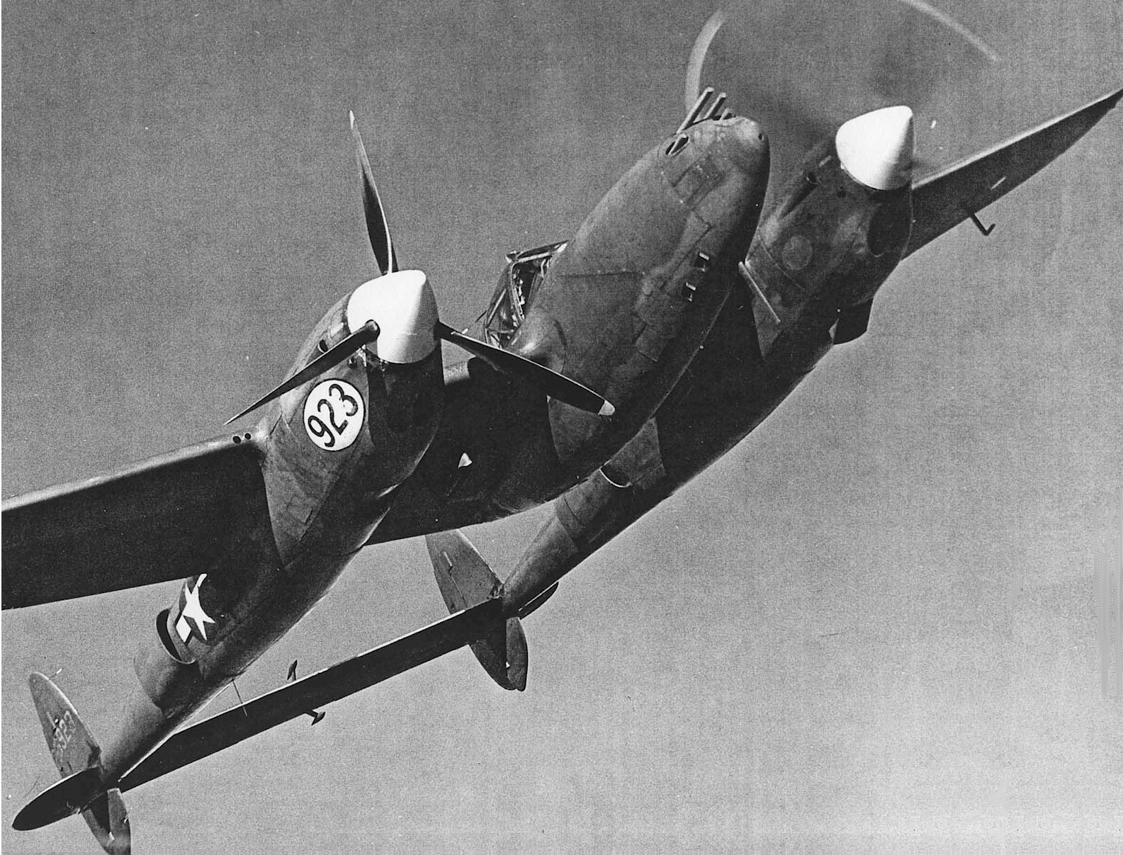 P-38 Lightning aircraft in flight during a demonstration, AAF Tactical Center, Orlando, Florida, United States, 1944-1945, photo 1 of 3; many said this plane would be un-flyable with one engine lost