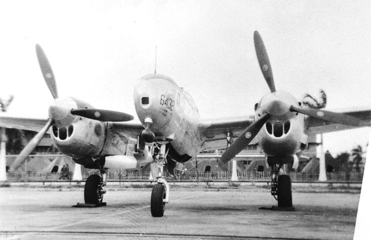 Nose on view of a F-5 Lightning aircraft at Hickam Field, Oahu, US Territory of Hawaii, 1945 (photo reconnaissance variant of the P-38J Lightning).