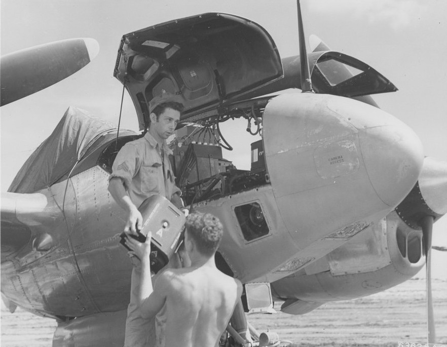 US Army photo technicians servicing a F-5B Lightning reconnaissance aircraft 'Lucky Lu', Kagman Field, Saipan, Mariana Islands, 1945, photo 2 of 2
