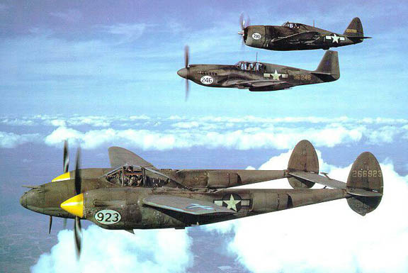 P-38H-5-LO Lightning, P-51A-10 Mustang, and P-47D Thunderbolt aircraft in flight together, United States, 1944-1945