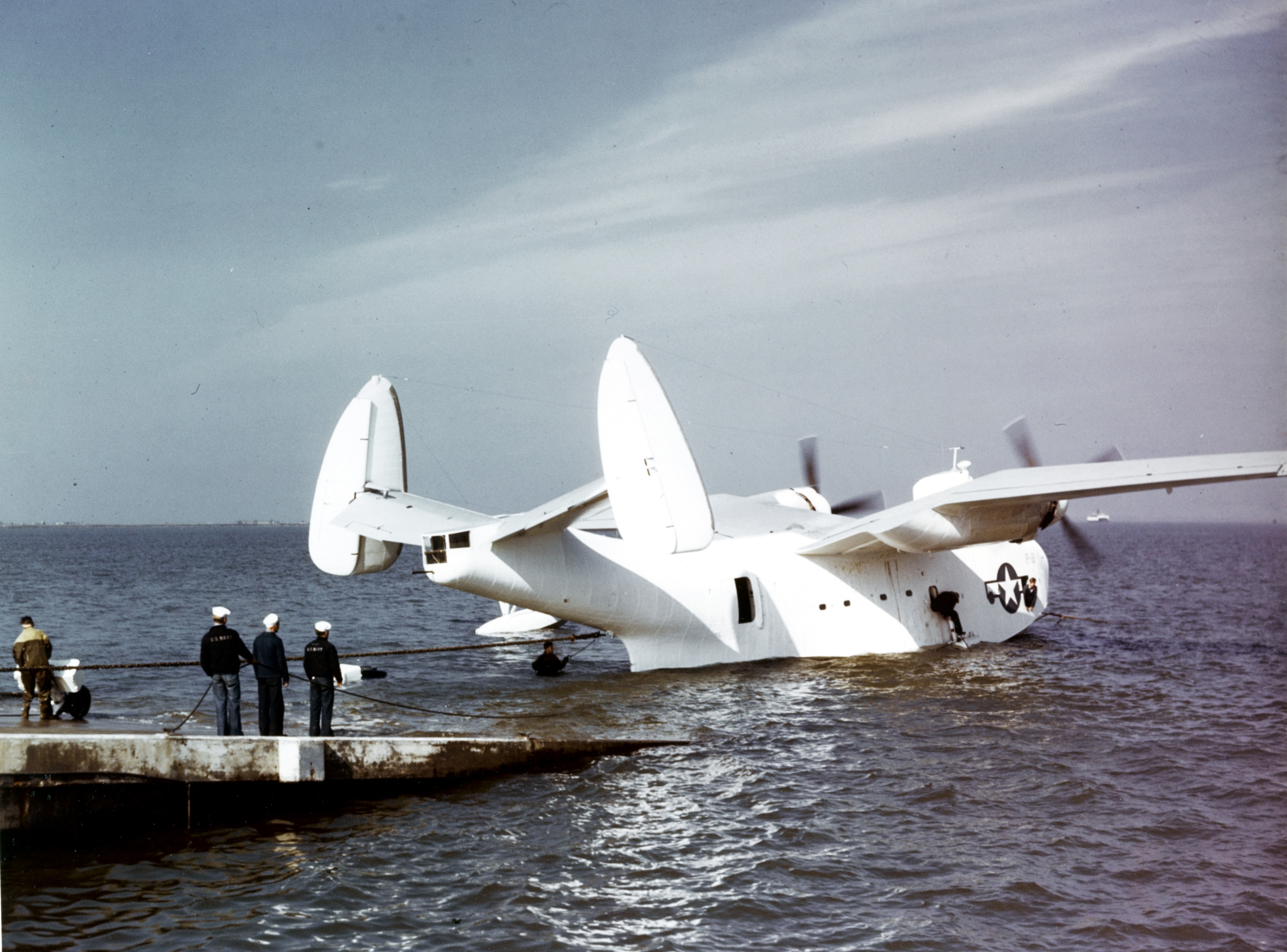 An US Navy beaching crew pulling a PBM-3S Mariner of patrol squadron VPB-206 out out the water, 1944-1945