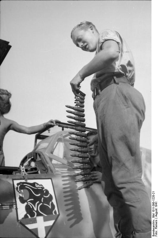 German armorer loading ammunition into a Bf 109 fighter of JG 54 'Grünherz' fighter wing, Russia, Aug 1941