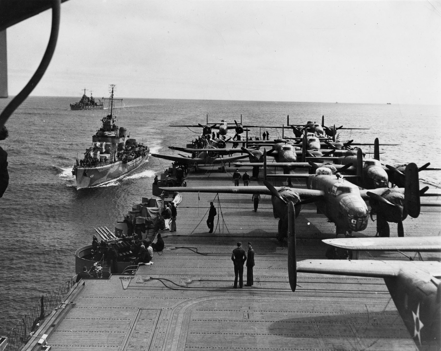 Aft flight deck of USS Hornet while en route to the launching point of the Doolittle Raid, Apr 1942; note USS Gwin and USS Nashville nearby
