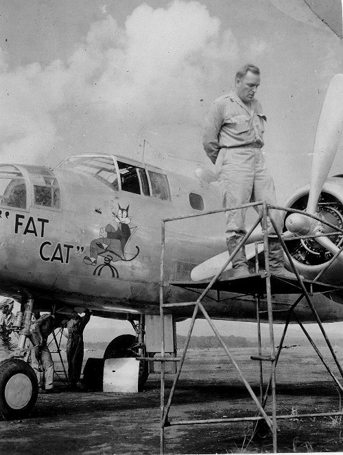 The dedication ceremony of B-25 bomber 'Fat Cat', Dobodura Airfield, Australian Papua, mid-1943; she had been salvaged using parts of damaged bombers and would be used to transport food; photo 2 of 4
