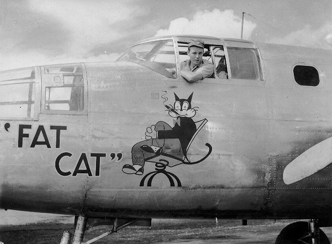 The dedication ceremony of B-25 bomber 'Fat Cat', Dobodura Airfield, Australian Papua, mid-1943; she had been salvaged using parts of damaged bombers and would be used to transport food; photo 3 of 4
