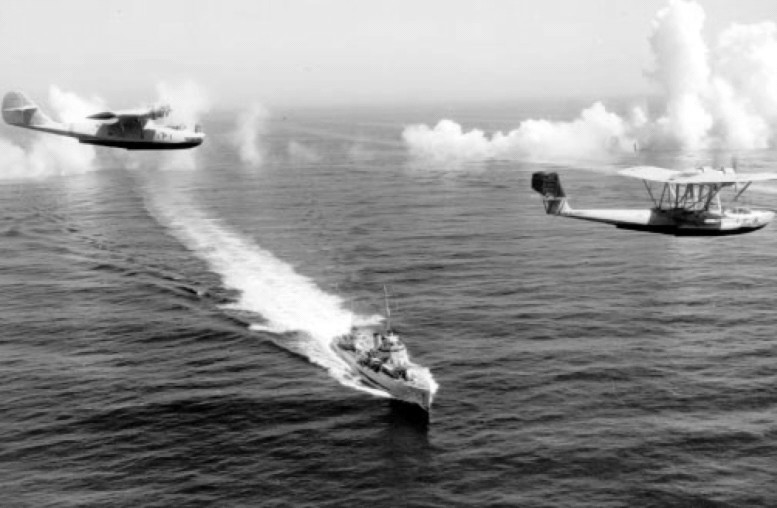 PBY-1 aircraft of US Navy squadron VP-11 and P2Y aircraft of VP-7 in flight over destroyer USS Dale, off San Diego, California, United States, 14 Sep 1936
