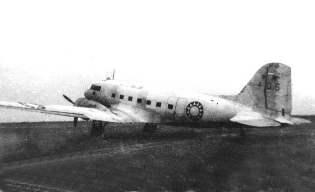 Captured Japanese Navy Type 0 Transport (Showa L2D) with Chinese markings at an airfield in Guangzhou, Guangdong Province, China, 1949