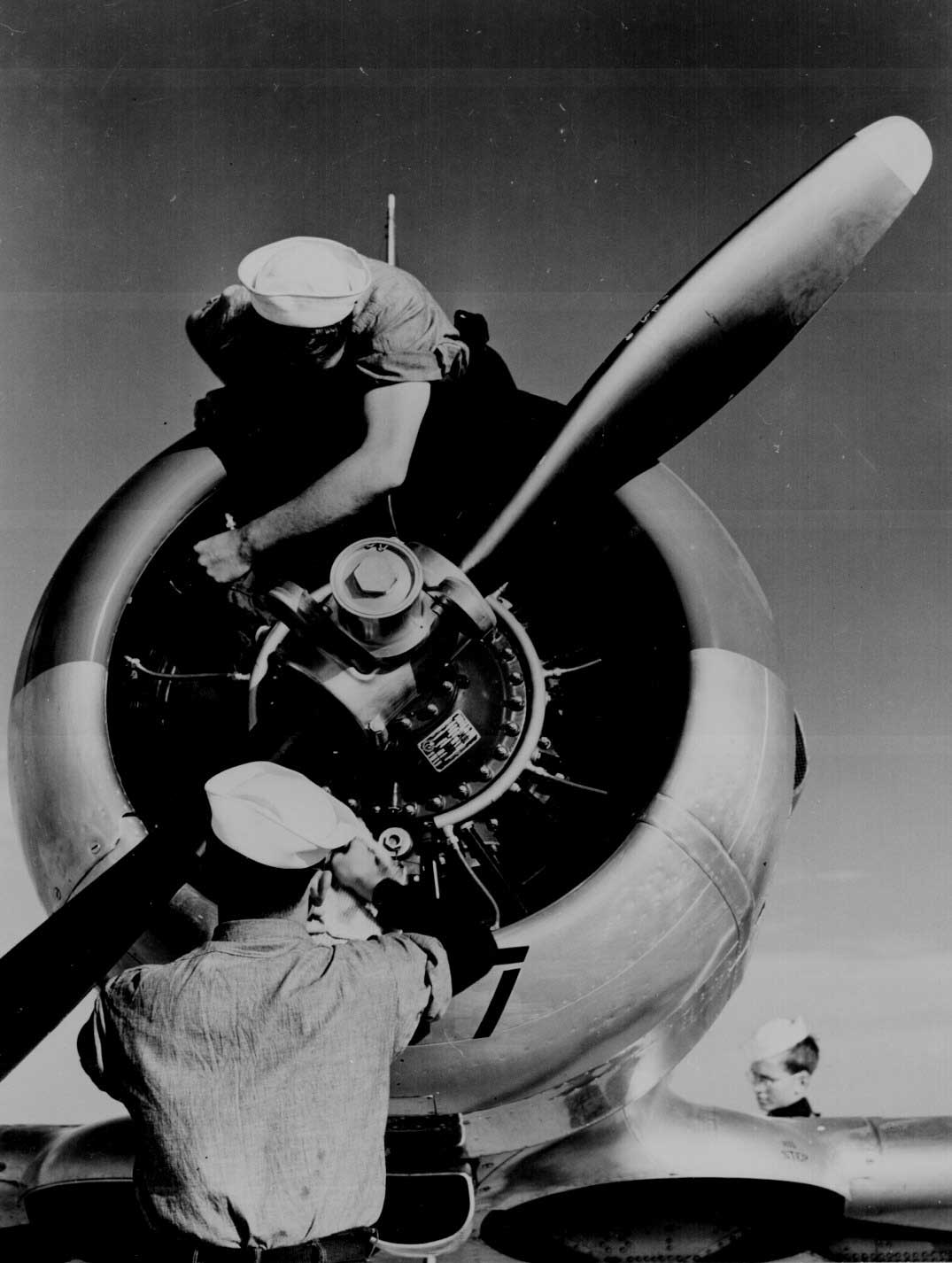 Mechanics check the engine of a SNJ at Kingsville Field, Corpus Christi, Texas, Nov 1942