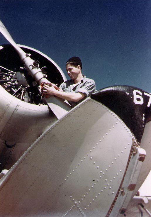US Navy Aviation Machinist's Mate polishing the propeller of a SOC Seagull floatplane at Naval Air Station, Pensacola, Florida, United States, circa 1940-41