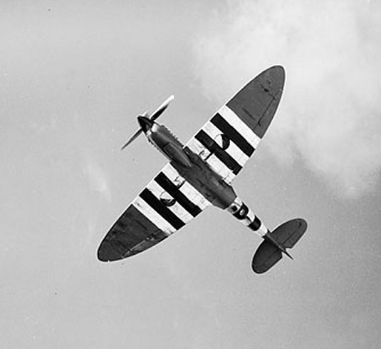 Spitfire PR Mark XI reconnaissance aircraft of No. 541 Squadron RAF based at Benson, Oxfordshire, England, UK in flight, Jul 1944; note split-pair camera ports under fuselage