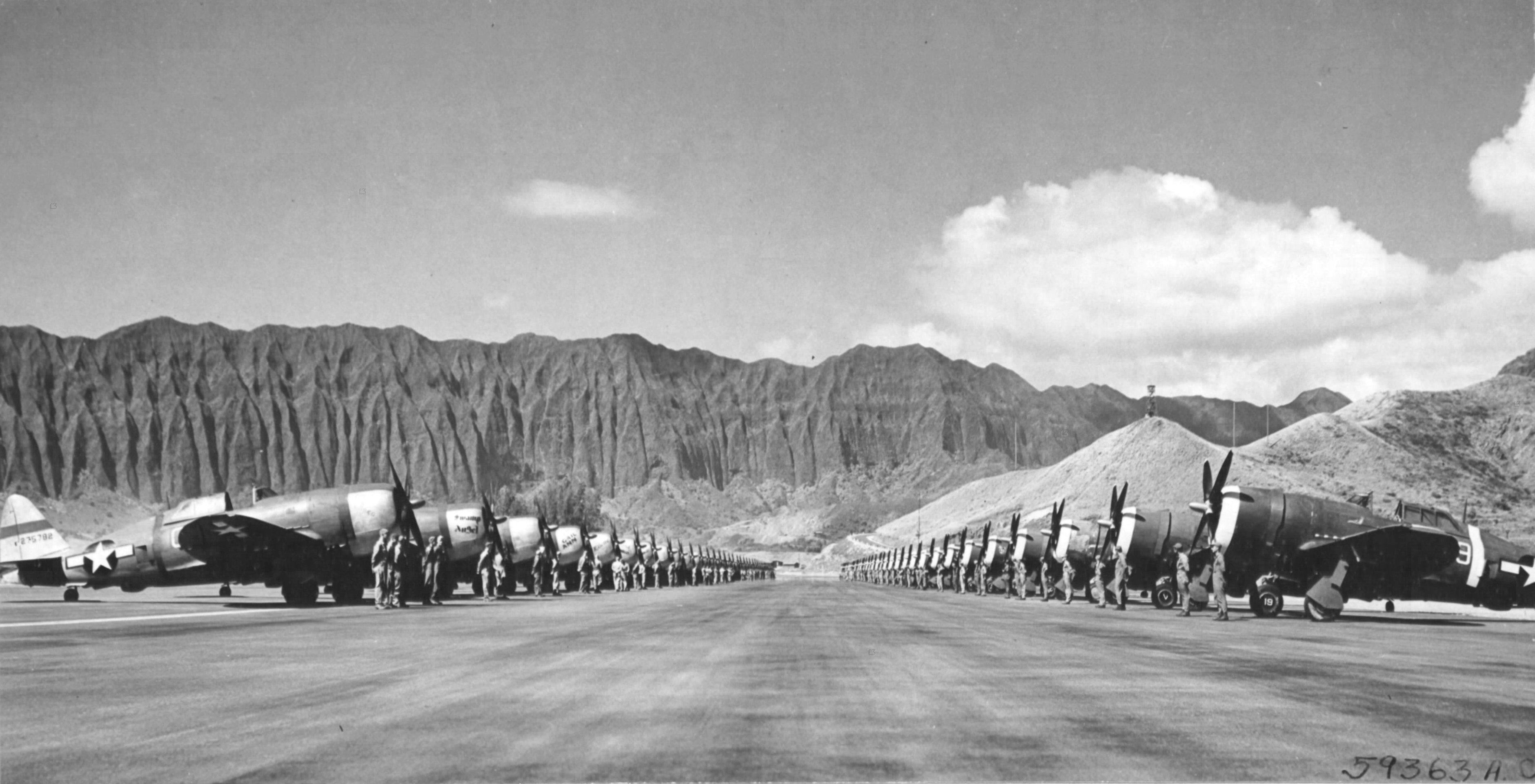 P-47 Thunderbolt aircraft of the 318th Fighter Group lined up for an inspection at Bellows Field, Oahu, US Territory of Hawaii, 15 May 1944. Photo 1 of 8.