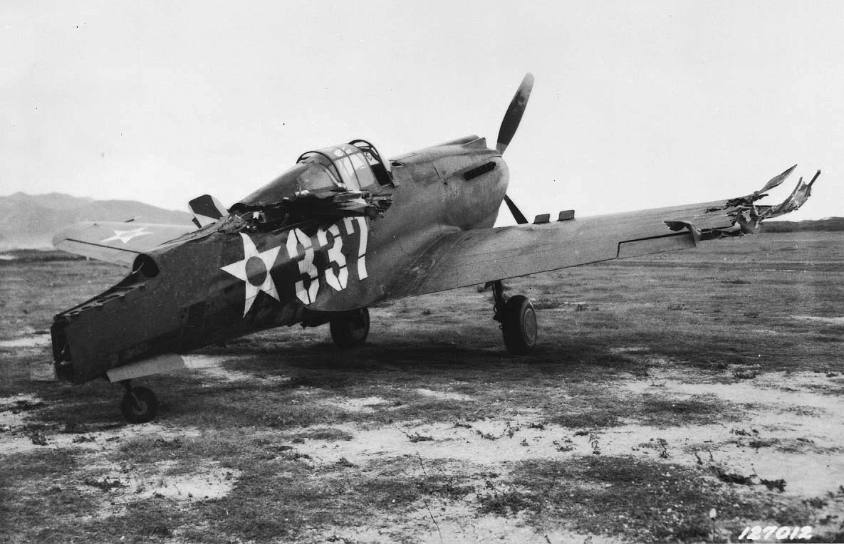 P-40 Warhawk aircraft damaged in a taxiing accident with another P-40 at Bellows Field, Oahu, US Territory of Hawaii, 8 Dec 1941, photo 1 of 3
