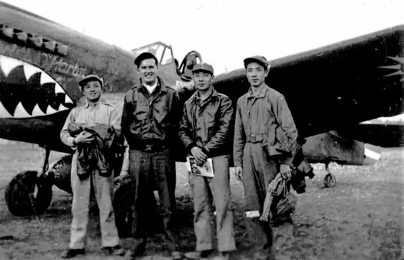 Pilots of 7th Fighter Squadron, Chinese-American Composite Wing (Provisional) Ye Wangfei, Squadron Leader Bill Reed, Xu Huajiang, and Tan Kun at Guilin Airfield, China, 4 Mar 1944