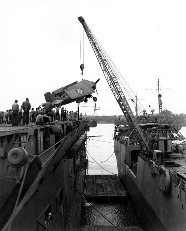 A Wildcat lifted from APV Kitty Hawk to ACV Long Island, Fila Harbor, New Hebrides (now Port Vila, Vanuatu), 28 Aug 1942