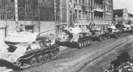 Knocked out and abandoned T-34 medium tanks line the streets of Kharkov, Ukraine, Feb 1943
