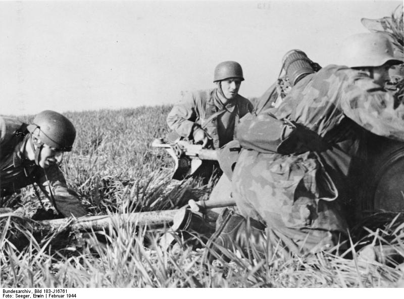 German paratroopers preparing a field gun for action, Nettuno, Italy, Feb 1944