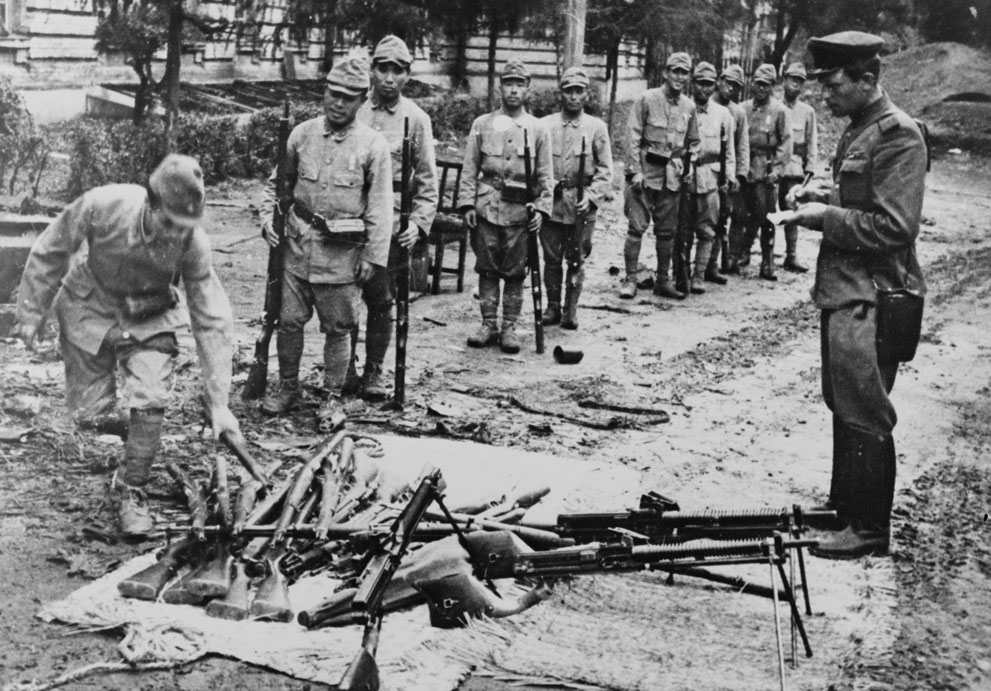 Japanese soldiers surrendering their weapons, northeastern China, Aug-Sep 1945