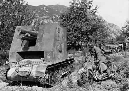 German vehicles in Yugoslavia or Greece, Apr 1941; sIG 33 self-propelled gun at left, DKW NZ350 motorcycle at right, SdKfz 10 in background