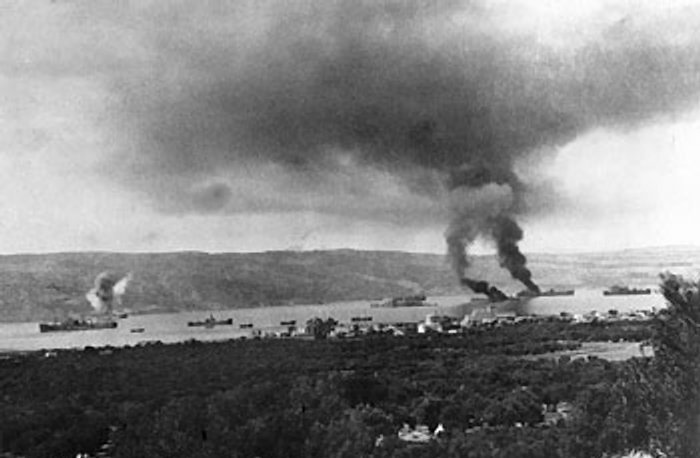 A pall of smoke hanging over the harbor in Souda Bay, Crete, Greece where two ships, hit by German bombs, were burning, 25 Jun 1941, photo 1 of 2