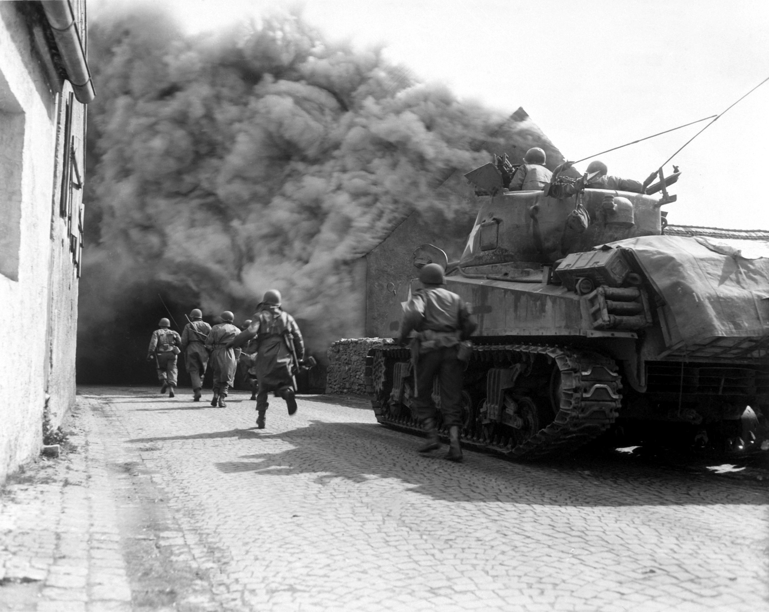 US 55th Armored Infantry Battalion men and US 22nd Tank Battalion tank in Wernberg, Bayreuth, Germany, 22 Apr 1945