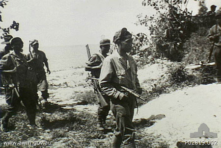 Men of the Royal Netherlands Indies Army Forces conducting mop-up operations on Tarakan, Borneo, late May 1945