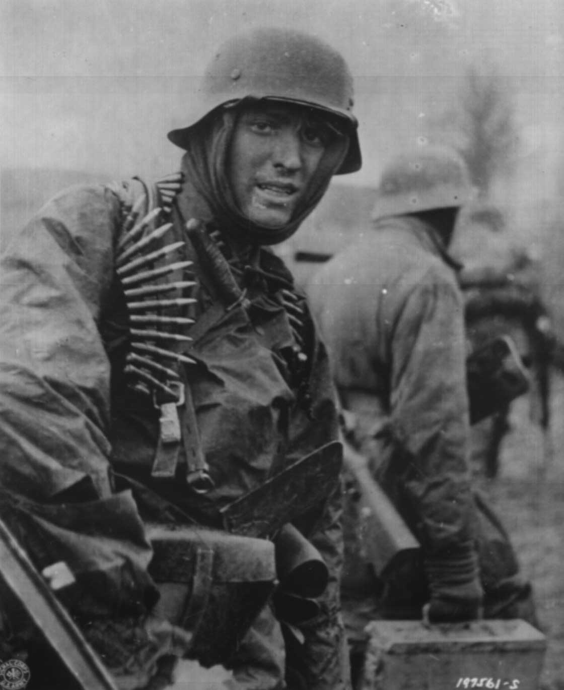 A heavily armed German soldier during the Ardennes Offensive, Dec 1944