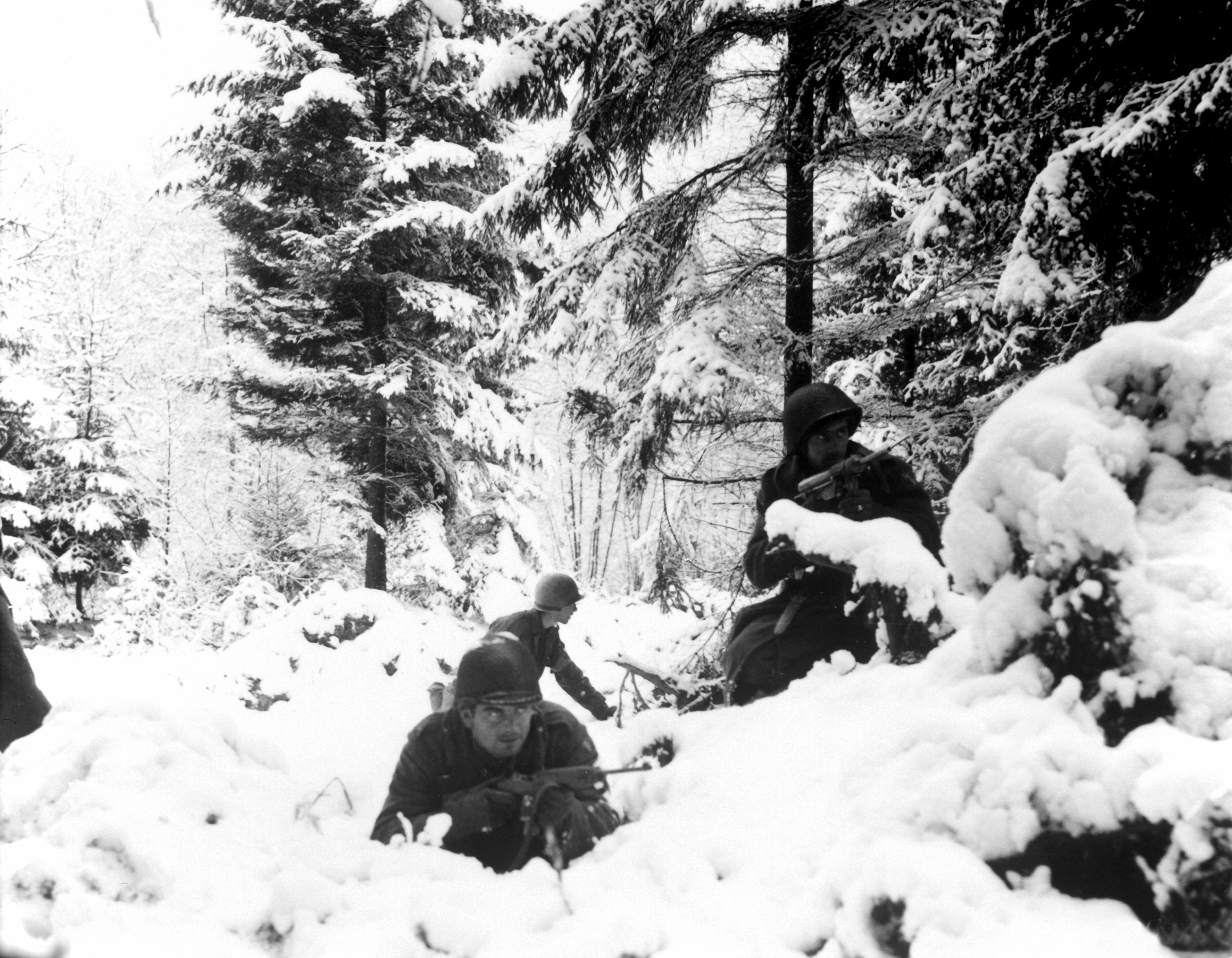 Men of US 290th Regiment in snowy terrain near Amonines, Belgium, 4 Jan 1945