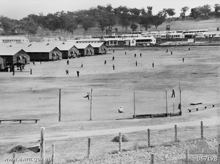 Japanese prisoners of war practising baseball at No. 12 Prisoner of War compound near Cowra, NSW, Australia, 1 Jul 1944