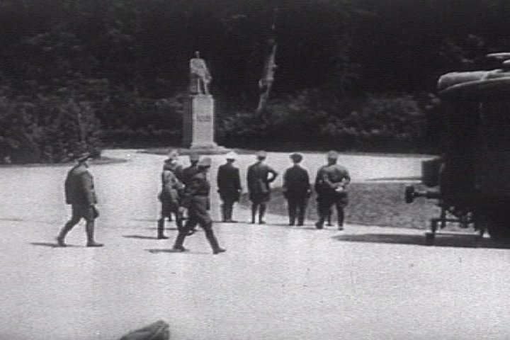 Hitler (hand on hip) looking at statue of F. Foch before meeting with French delegation for negotiation of the armistice document, Compiègne, France, 22 Jun 1940; still from 1943 film 'Why We Fight'