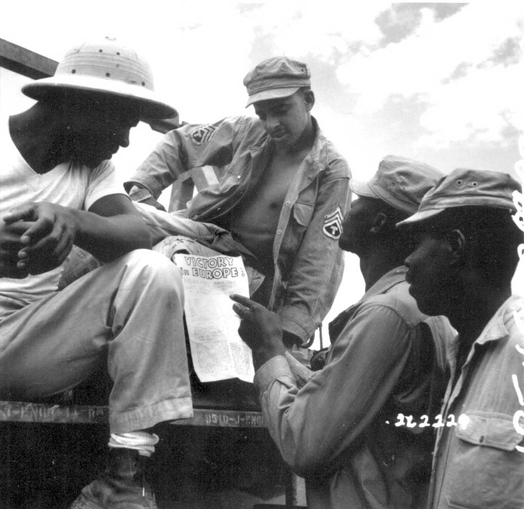 African-American troops read President Truman's Proclamation of Victory in Europe, Burma, 9 May 1945