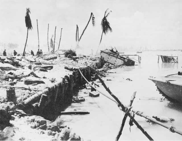 Wreck of an American tractor stuck on a log wall, Betio, Tarawa Atoll, 21 Nov 1943