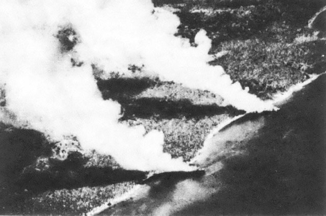 Two beached Japanese transports burning after US aerial attack near Tassafaroga Point, Guadalcanal, 15 Nov 1942