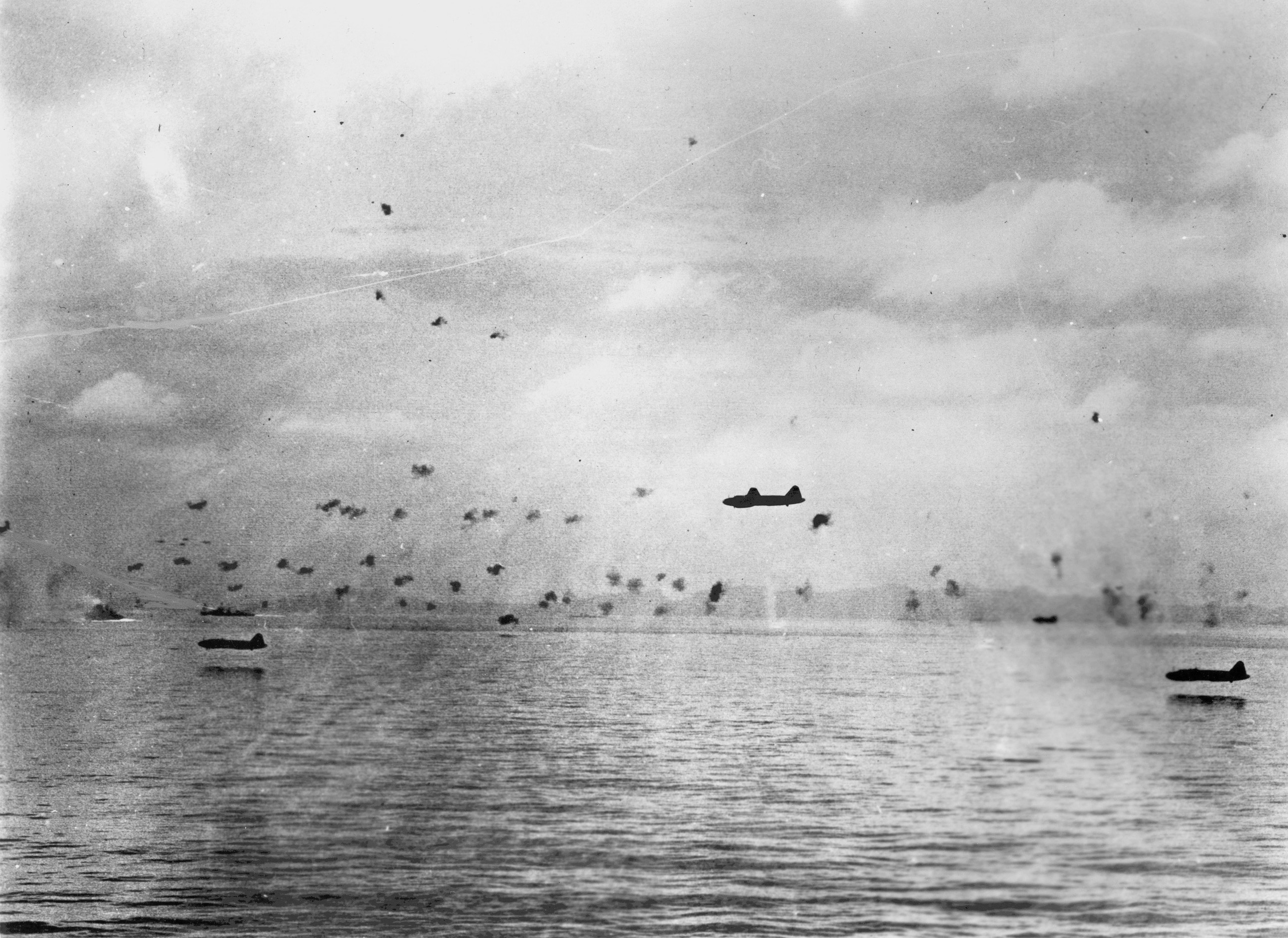 Japanese G4M aircraft making a torpedo run against the American Guadalcanal-Tulagi invasion force, 8 Aug 1942