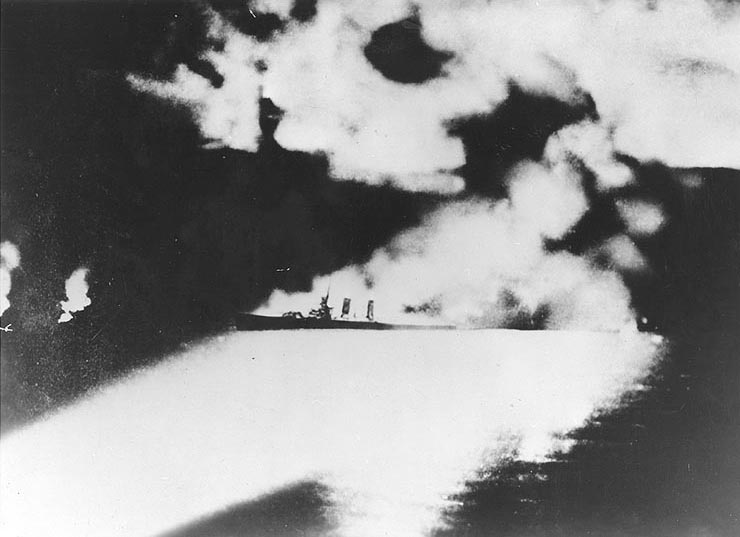Quincy illuminated by Japanese searchlights during Battle of Savo Island, 9 Aug 1942