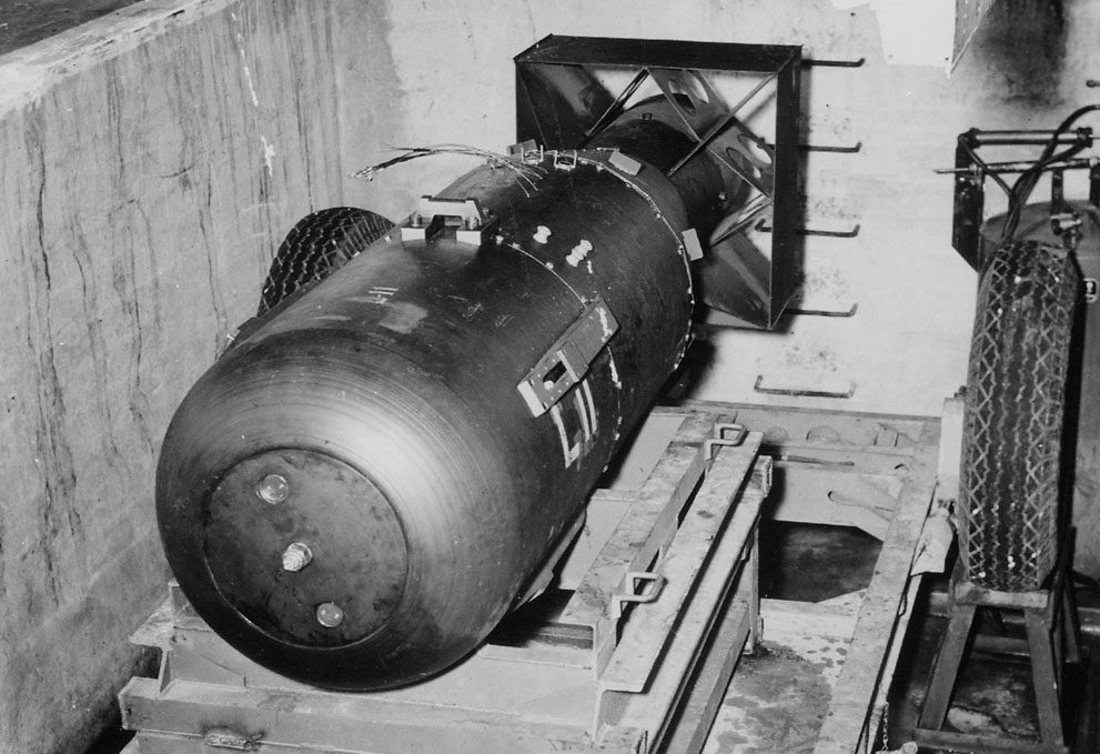 'Little Boy' bomb in a bomb pit, ready to be loaded onto B-29 bomber 'Enola Gay', Tinian, Mariana Islands, 6 Aug 1945, photo 2 of 3