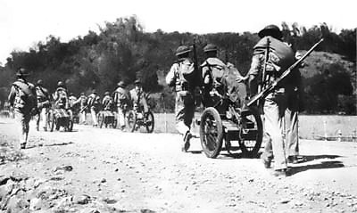 Men of H Company, 2d Battalion, US 4th Marines moved ammunition to Longoskawayan Point, Luzon, Philippines, Jan 1942