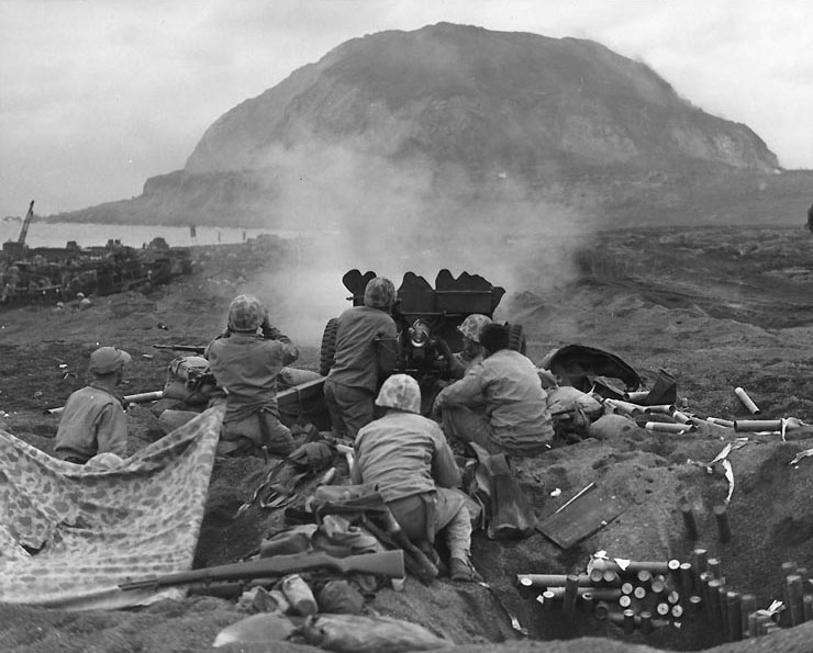 US Marine 37mm gun firing on Japanese positions on the northern slope of Mt. Suribachi, Iwo Jima in support of RCT 28, 21 Feb 1945