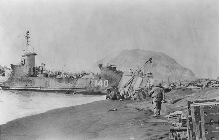 LSM-140 unloading on a southeastern Iwo Jima beach, circa 21-22 Feb 1945