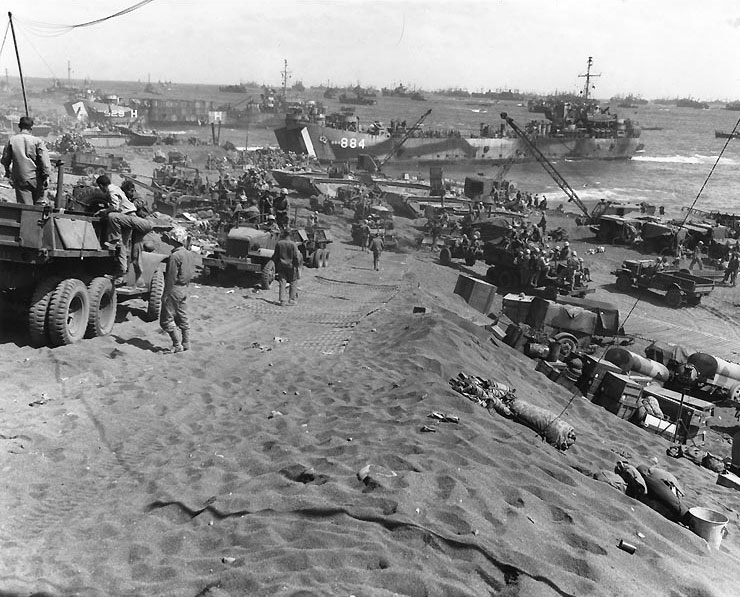 Vehicles on Iwo Jima's Red Beach, circa 25 Feb 1945; LST-884 and LST-929 in background